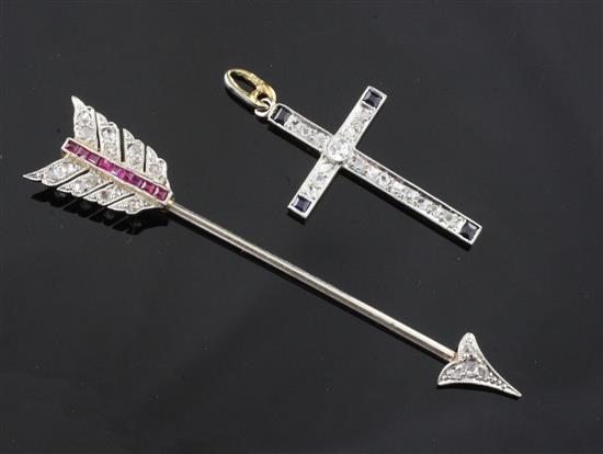 A Belle Epoque gold and platinum, ruby and diamond set arrow jabot pin and cross pendant.
